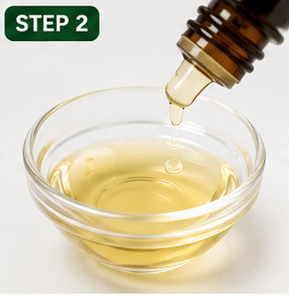 Step 2: Mix 2–3 drops of tea tree oil with 1 teaspoon of carrier oil. 